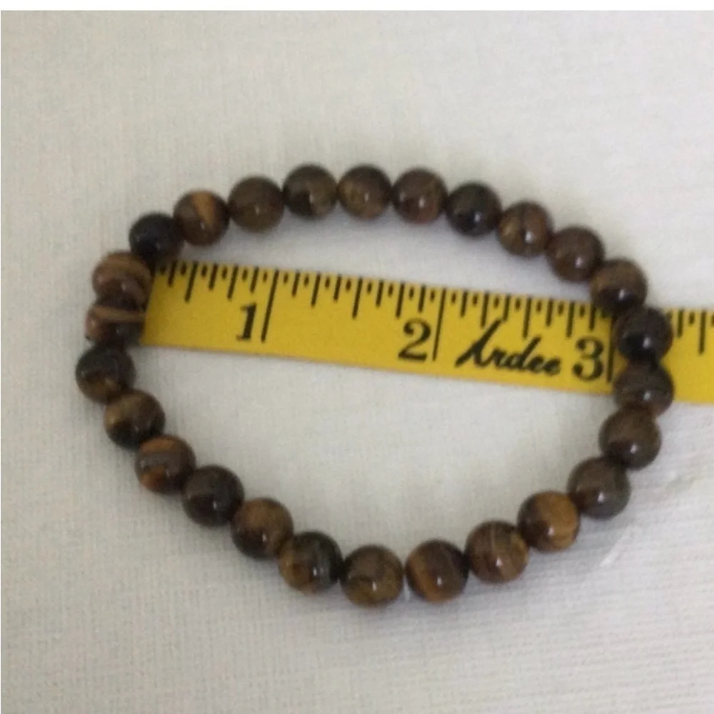 Woman’s Cats Eye Polished Beaded color brown stretch elastic